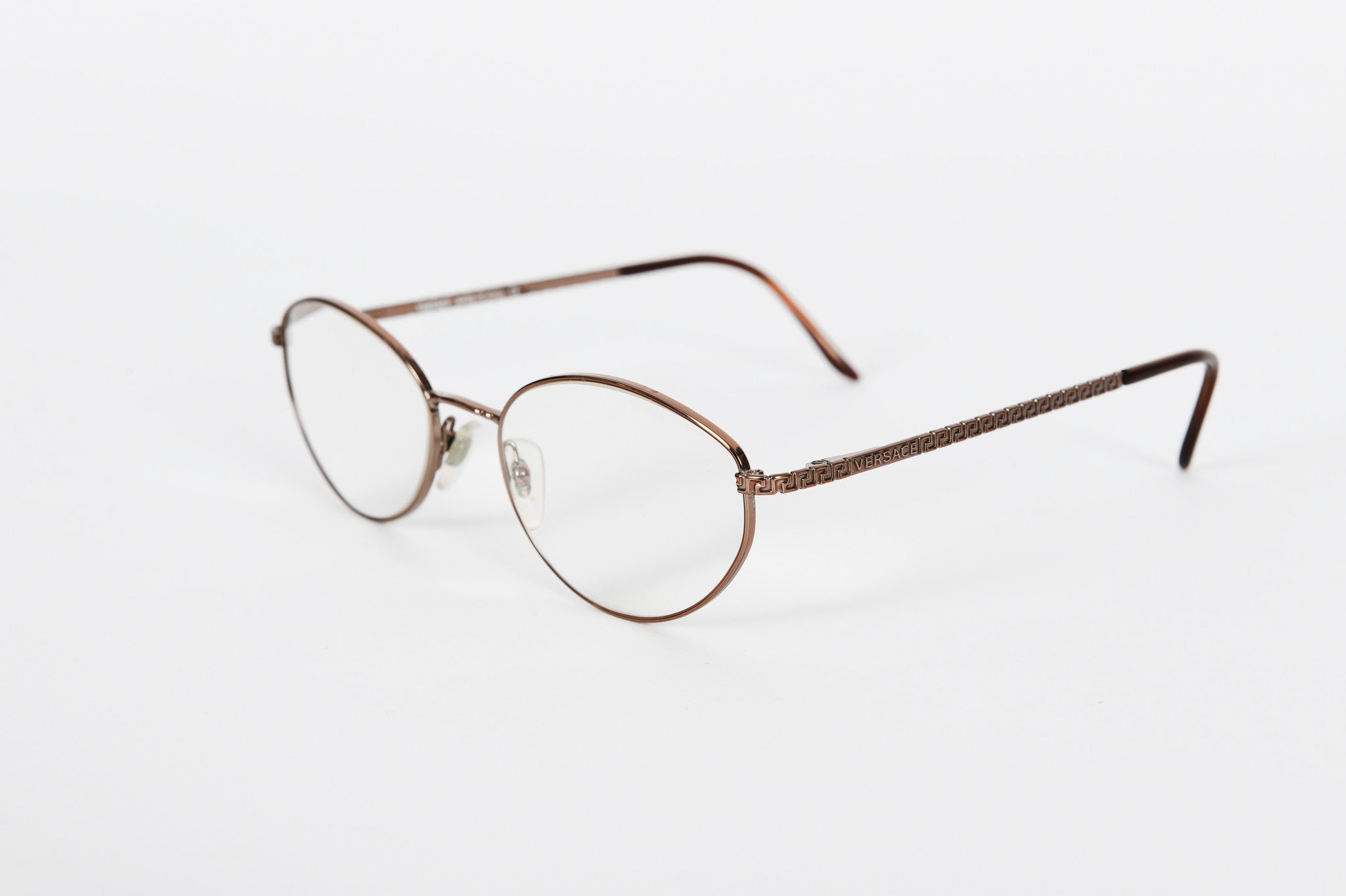 Gold Versace metal frame with detail on sides