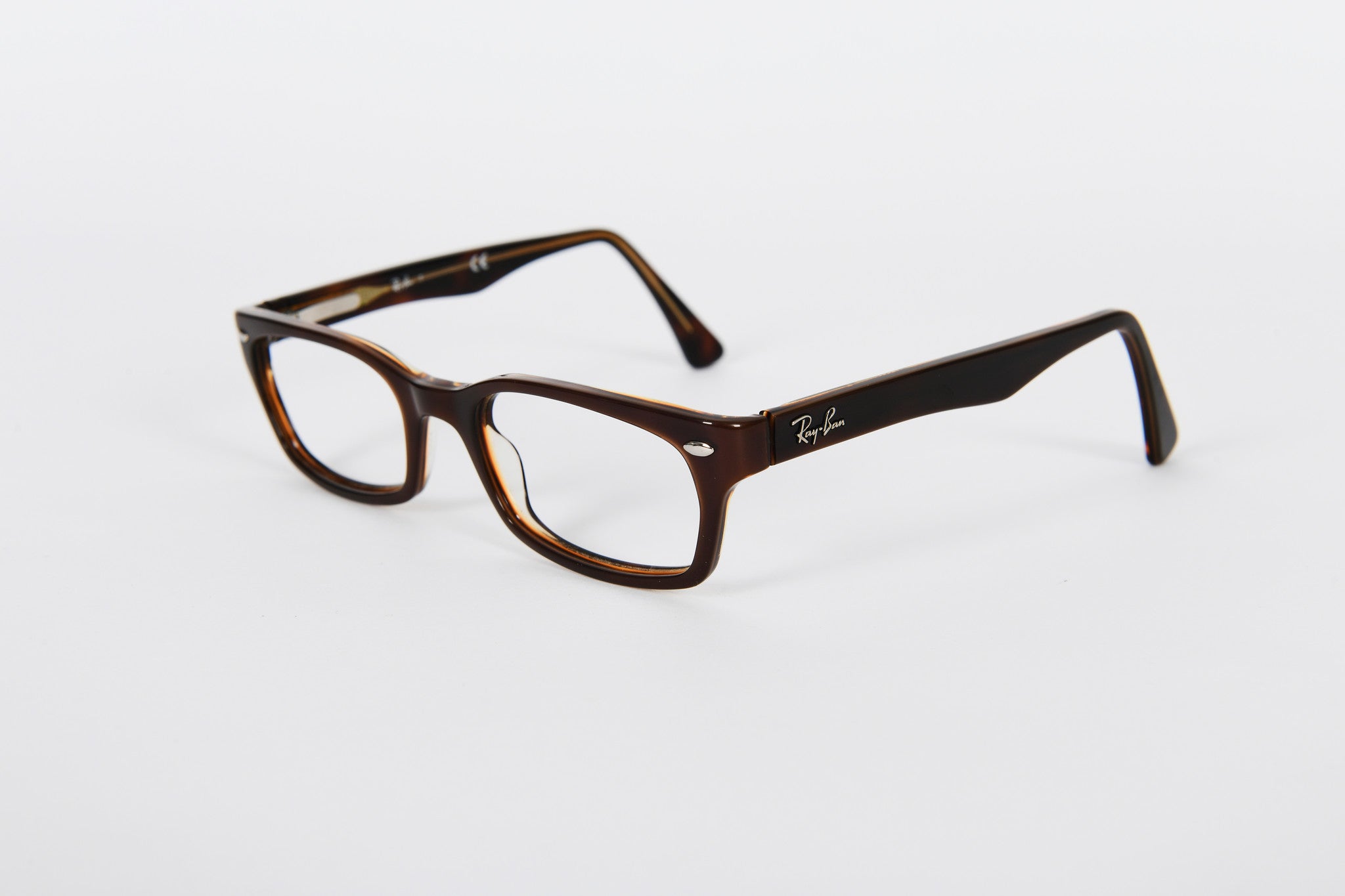 Brown Ray-Ban with gold detail on inside of sides