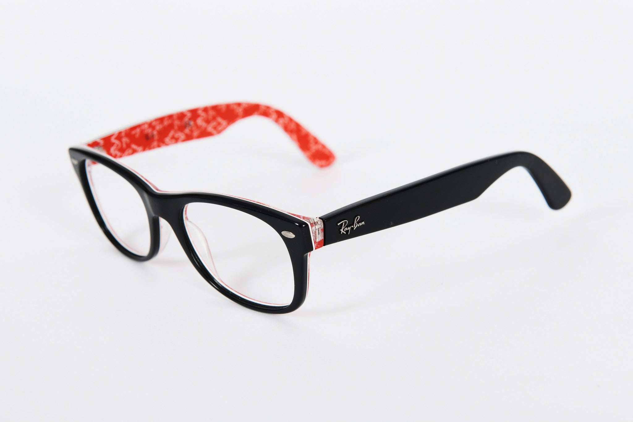 Black Ray-Ban Wayfarer shape frames with red logo pattern on insides