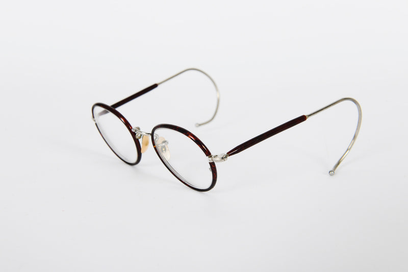 Small round metal retro NHS frames with tortoiseshell rims and curl sides