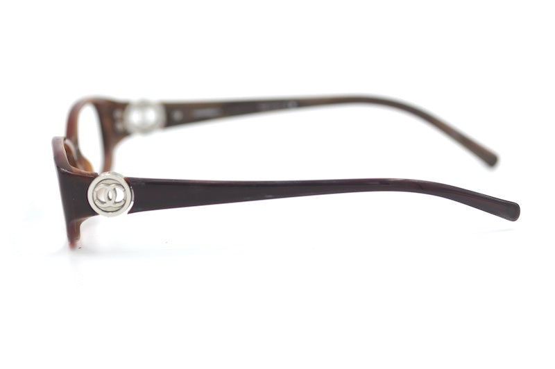 Chanel 3112 650 Glasses. Red rectangular Chanel glasses. Cheap Chanel glasses UK. Sustainable eyewear online. Women's sustainable designer glasses.