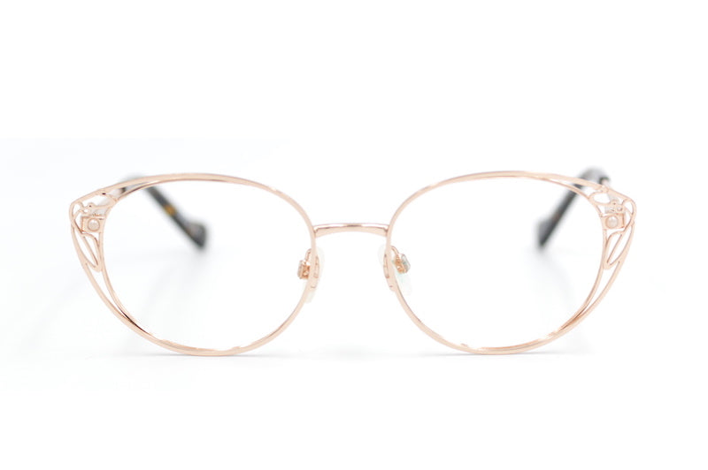 Liberty 10 glasses. Women's designer glasses. Low cost designer glasses. Cheap designer glasses. Rose gold cat eye glasses. 