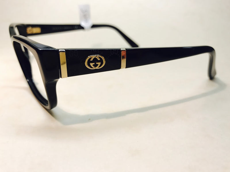 Black Gucci unisex designer frames with gold logo detail