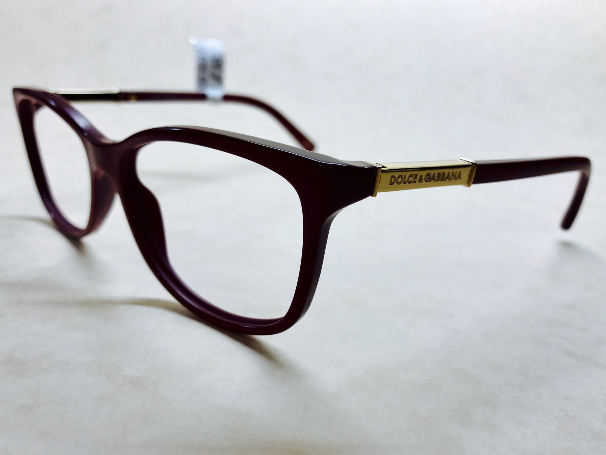 Dark red round D&amp;G frames with gold detail on sides