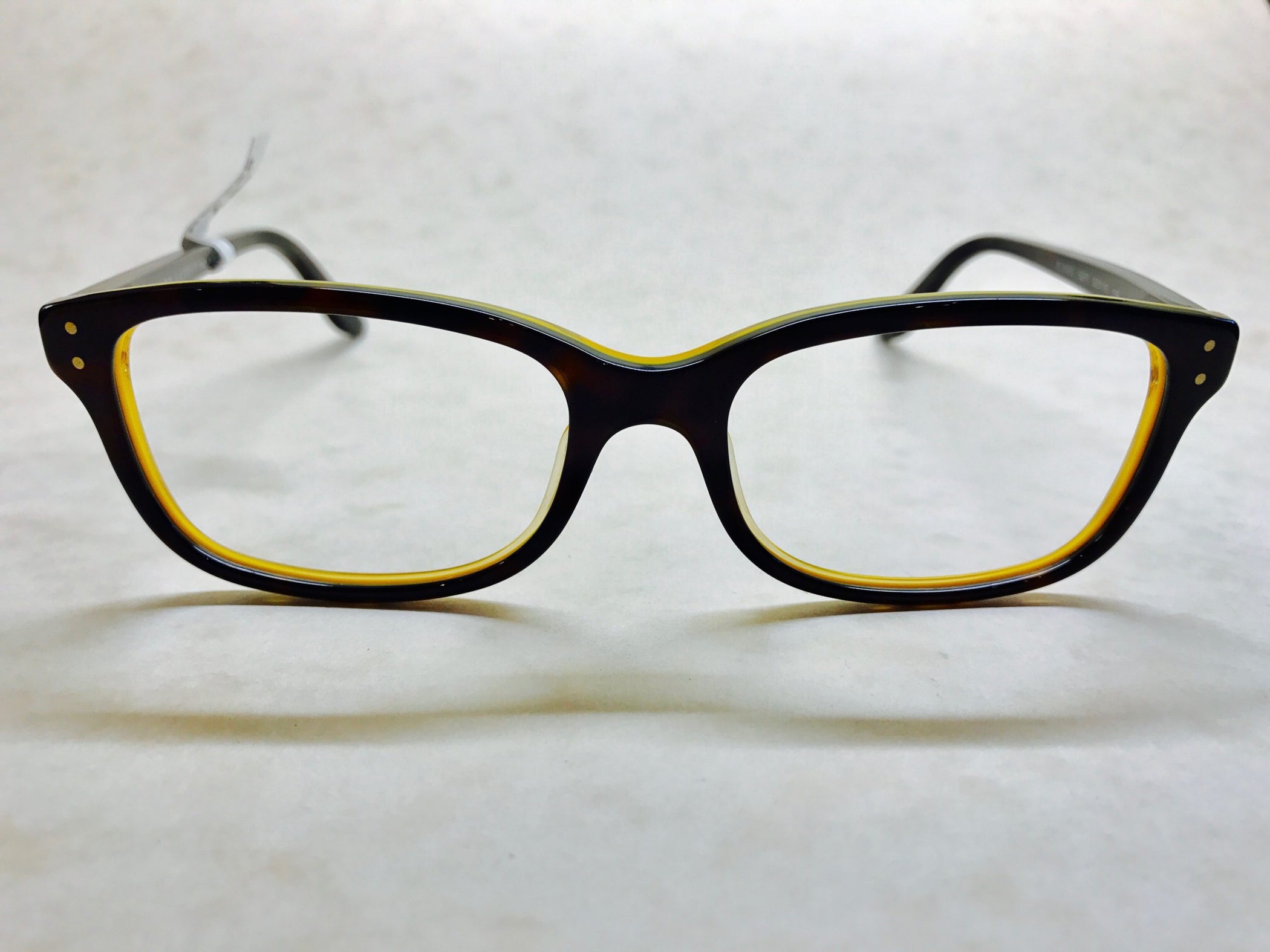 Dark tortoiseshell Ralph Lauren frames with yellow inside