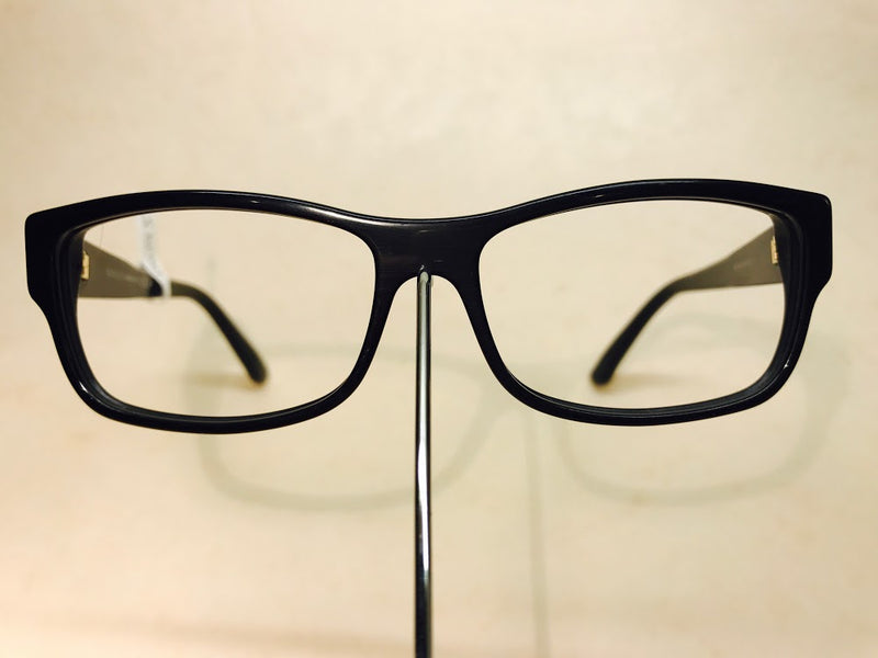 Black Gucci unisex designer frames with gold logo detail