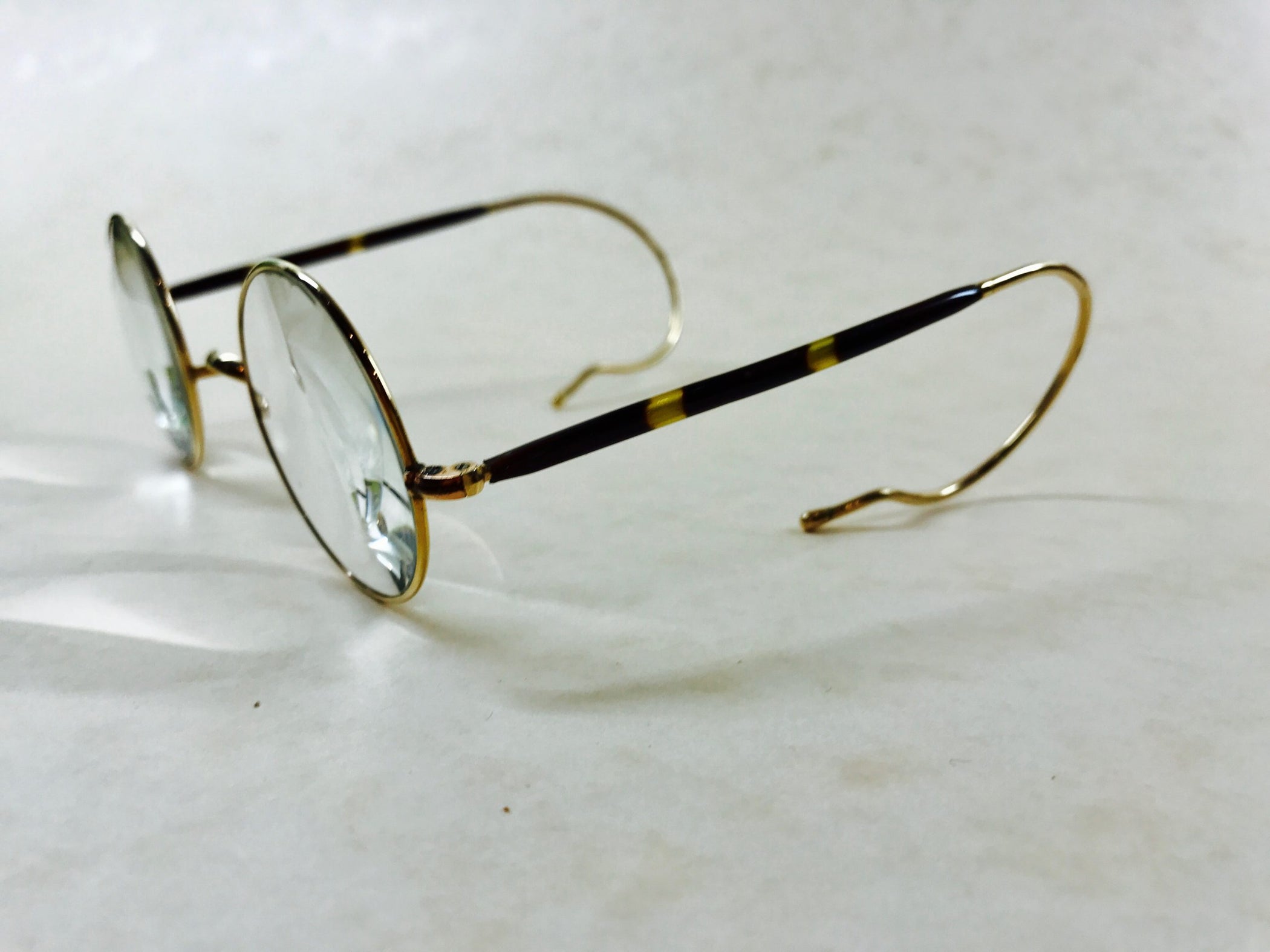 Antique round gold frames with curl sides