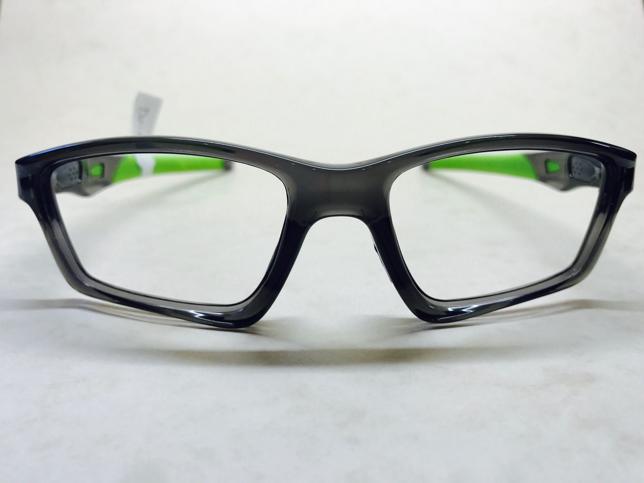 Dark grey and green Oakley Crossline designer frame