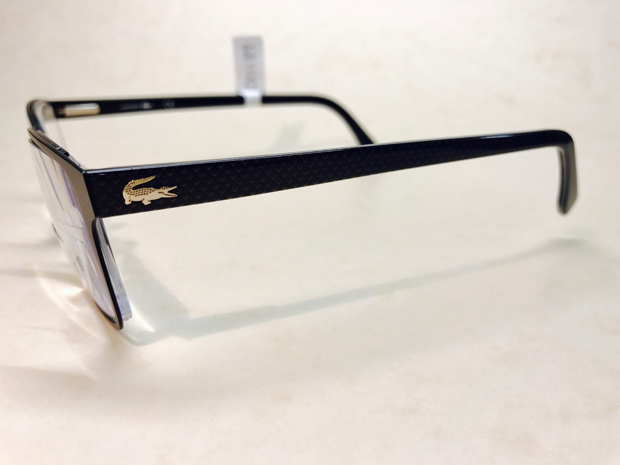 Black metal Lacoste frames with textured sides