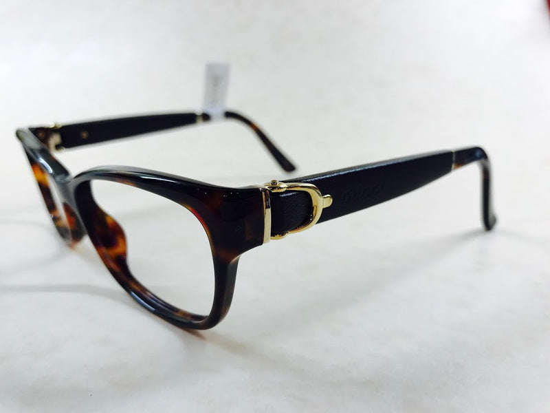 Tortoiseshell Gucci frames with leather sides