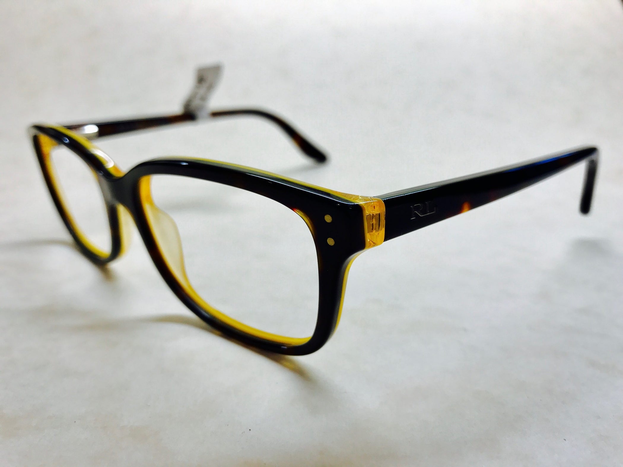 Dark tortoiseshell Ralph Lauren frames with yellow inside