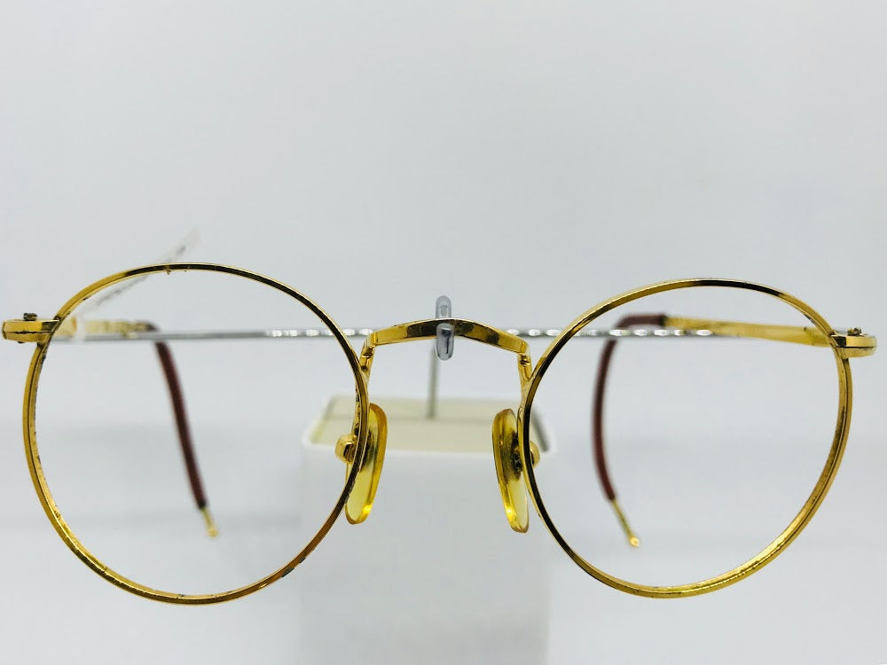 Gold plated round gold metal 1940s frame with curl sides