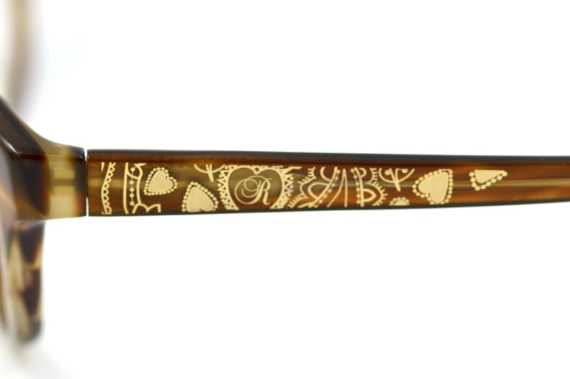 Red or Dead women's brown cat-eye glasses.