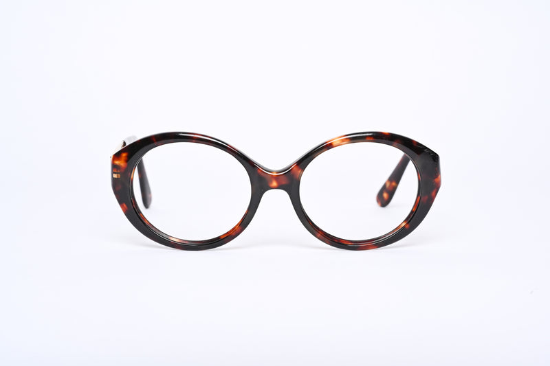 Guess designer glasses. Women's Guess glasses. Brown mottled oval glasses. Women's brown oval shaped glasses.