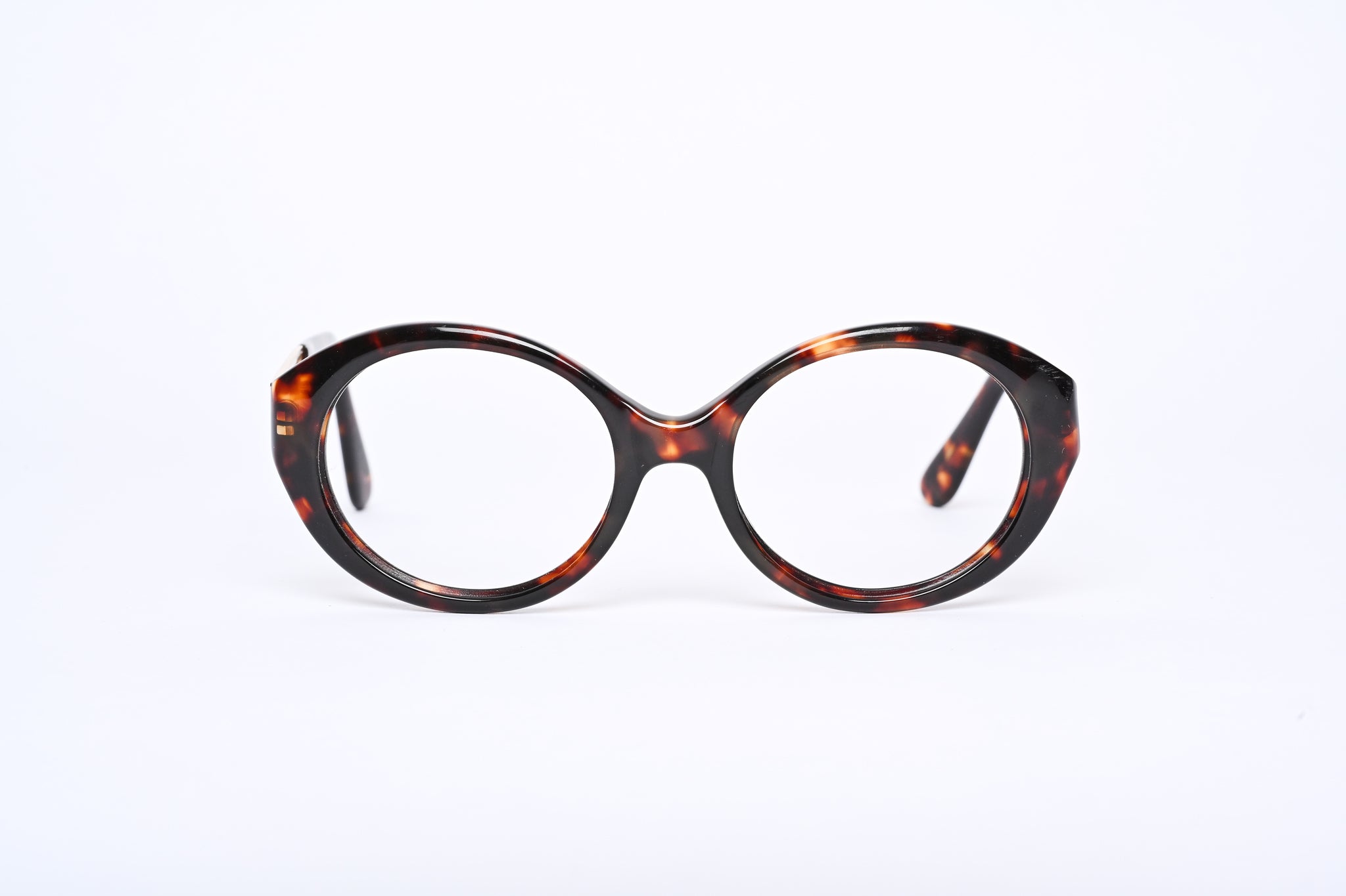 Guess designer glasses. Women's Guess glasses. Brown mottled oval glasses. Women's brown oval shaped glasses.